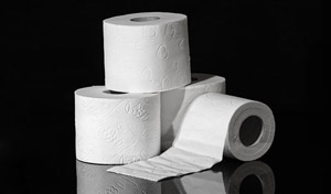 Three toilet rolls on a black background